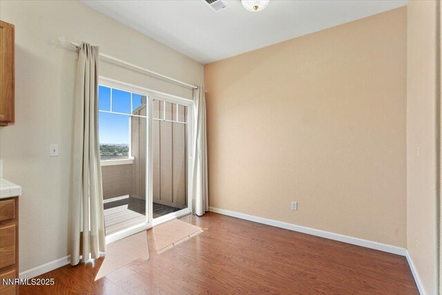 4136 Kathleen Denise Ln, Reno, NV 89503 - empty room featuring wood finished floors and baseboards
