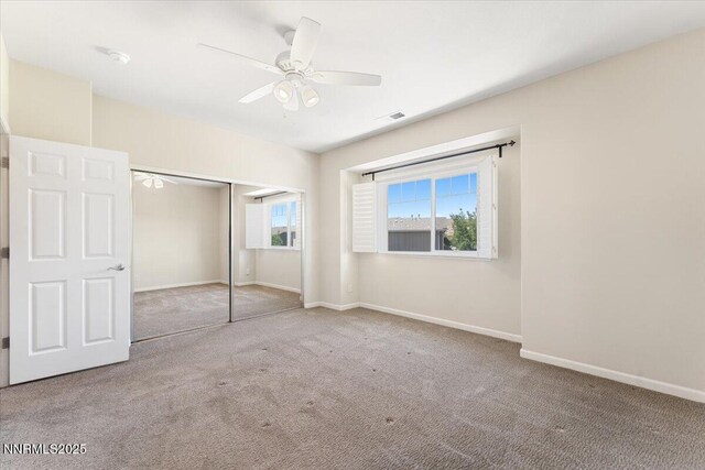4136 Kathleen Denise Ln, Reno, NV 89503 - unfurnished bedroom featuring carpet, baseboards, a closet, and a ceiling fan