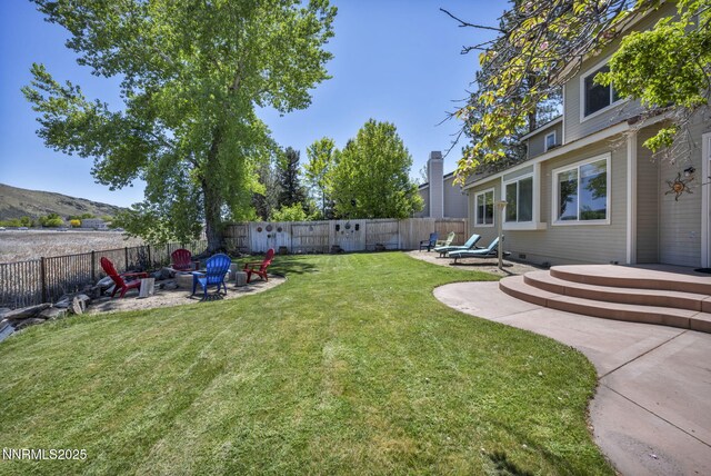 3250 Eaglewood Dr, Reno, NV 89502 - view of yard with an outdoor fire pit, a wooden deck, and a patio area