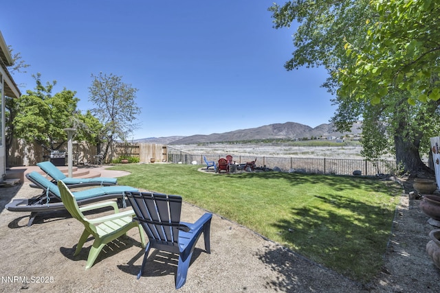 3250 Eaglewood Dr, Reno, NV 89502 - view of yard featuring a mountain view and a patio area
