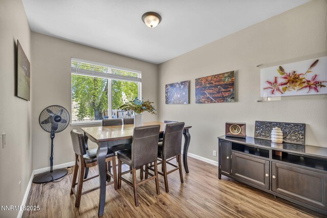 3250 Eaglewood Dr, Reno, NV 89502 - dining space featuring baseboards and wood finished floors