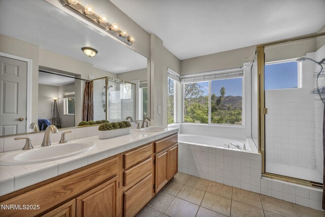 3250 Eaglewood Dr, Reno, NV 89502 - full bath featuring a shower stall, tile patterned flooring, double vanity, and a bath