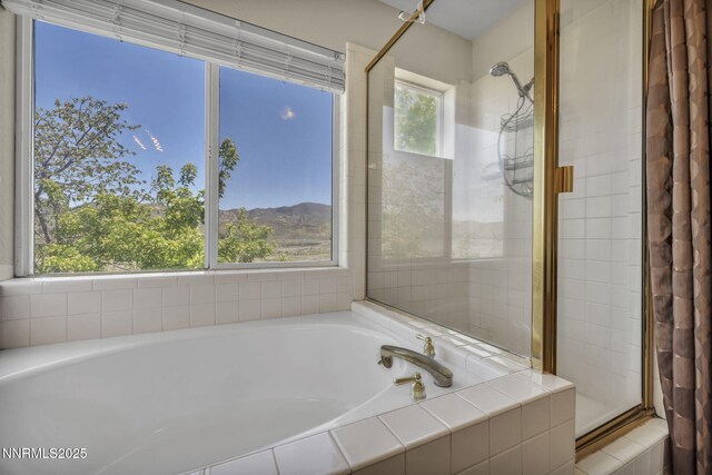 3250 Eaglewood Dr, Reno, NV 89502 - bathroom with tiled shower and a bath
