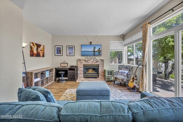 3250 Eaglewood Dr, Reno, NV 89502 - living area with plenty of natural light, wood finished floors, and a fireplace