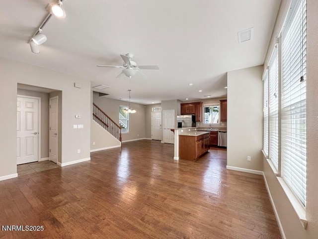 2180 Alamo Square Way, Reno, NV 89509 - unfurnished living room with a ceiling fan, dark wood-style flooring, a chandelier, and recessed lighting