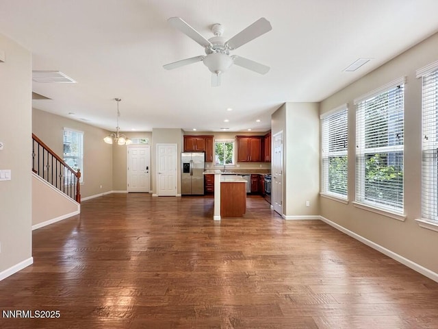 2180 Alamo Square Way, Reno, NV 89509 - unfurnished living room featuring a chandelier, dark wood finished floors, ceiling fan, recessed lighting, and stairs