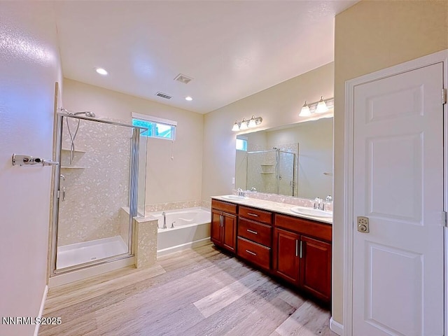 2180 Alamo Square Way, Reno, NV 89509 - full bath featuring wood finished floors, a bath, a shower stall, and double vanity