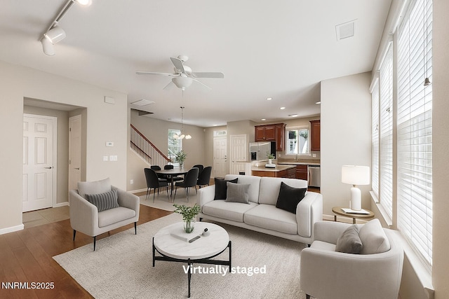 2180 Alamo Square Way, Reno, NV 89509 - living room with light wood-type flooring, a ceiling fan, recessed lighting, and rail lighting