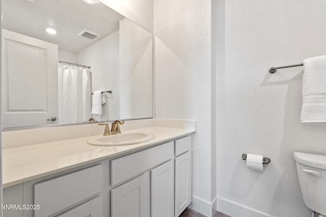 1440 Solitude Trl, Reno, NV 89523 - bathroom with toilet, vanity, and baseboards