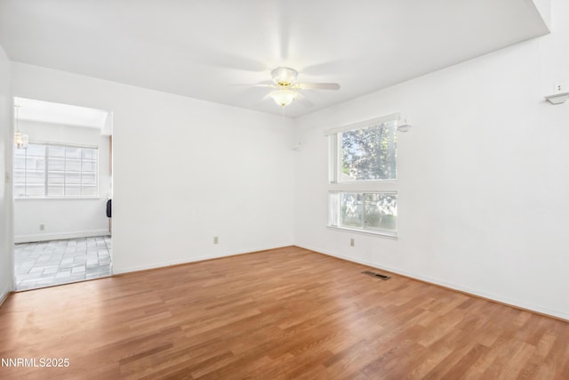7554 Whimbleton Way, Reno, NV 89511 - empty room with ceiling fan, wood finished floors, and baseboards