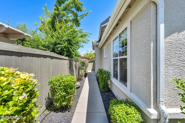 10559 Iron Point Cir, Reno, NV 89521 - view of side of property with stucco siding and a fenced backyard