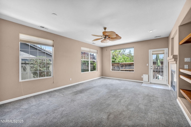 10559 Iron Point Cir, Reno, NV 89521 - unfurnished living room featuring carpet floors and a ceiling fan