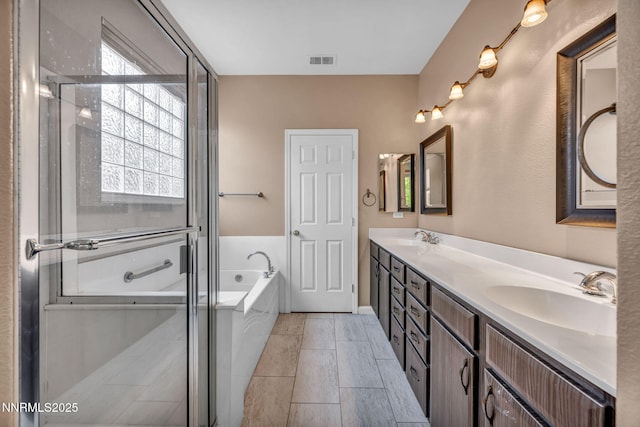 10559 Iron Point Cir, Reno, NV 89521 - bathroom featuring double vanity, a garden tub, and a shower stall