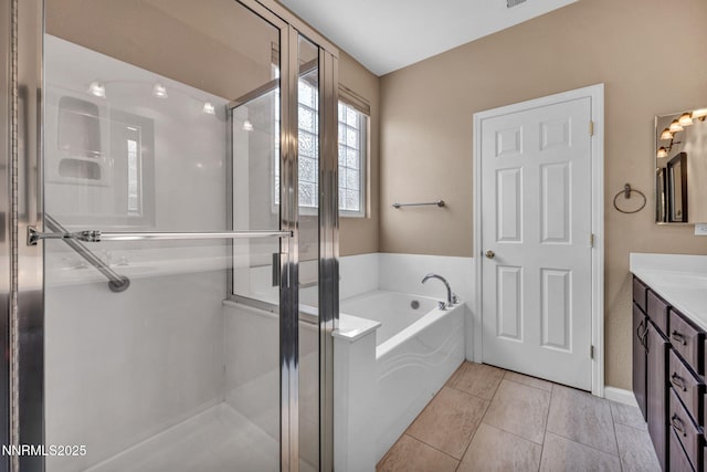10559 Iron Point Cir, Reno, NV 89521 - full bath with vanity, a garden tub, a stall shower, and tile patterned flooring