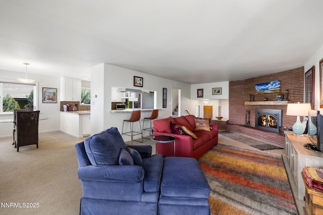1435 Palisade Dr, Reno, NV 89509 - living area with a fireplace, light colored carpet, and stairs