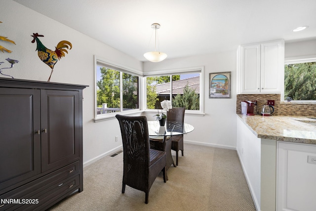 1435 Palisade Dr, Reno, NV 89509 - dining space with healthy amount of natural light, baseboards, and light colored carpet