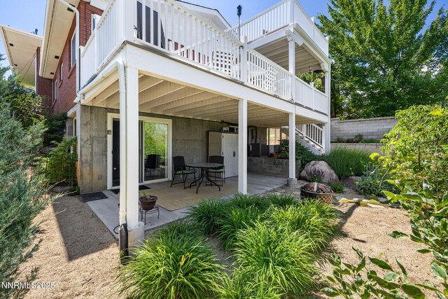 1435 Palisade Dr, Reno, NV 89509 - view of patio / terrace featuring an outdoor fire pit, stairs, and a balcony