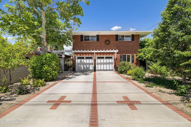 1435 Palisade Dr, Reno, NV 89509 - view of front facade featuring concrete driveway, an attached garage, and brick siding