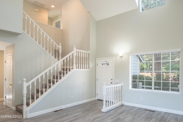 4734 Tierrapark Ct, Reno, NV 89502 - entryway with a towering ceiling, wood finished floors, stairs, and healthy amount of natural light