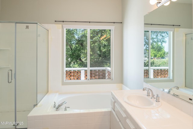 4734 Tierrapark Ct, Reno, NV 89502 - full bath featuring vanity, plenty of natural light, a bath, and a stall shower
