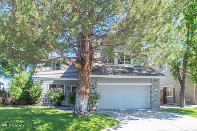 4734 Tierrapark Ct, Reno, NV 89502 - view of front of property featuring concrete driveway, stone siding, an attached garage, and a front yard