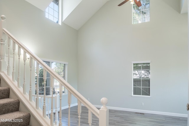 4734 Tierrapark Ct, Reno, NV 89502 - stairs featuring high vaulted ceiling, plenty of natural light, wood finished floors, and ceiling fan