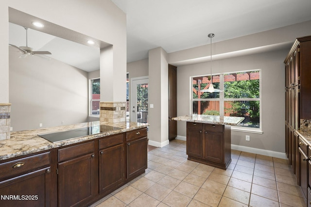 4175 Falling Water Dr, Reno, NV 89519 - kitchen with black electric cooktop, baseboards, dark brown cabinetry, and plenty of natural light