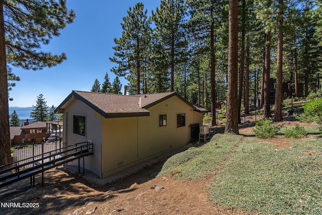 909 Tyner Way, Incline Village, NV 89451 - view of side of home featuring a shingled roof and a mountain view