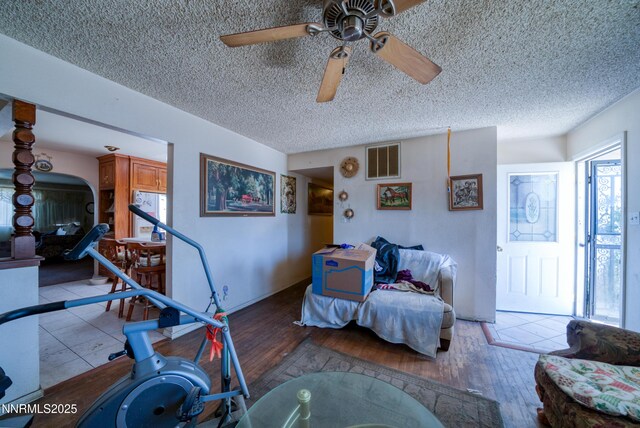 1650 Trabert Way, Sparks, NV 89431 - workout area featuring ceiling fan, a textured ceiling, and wood finished floors