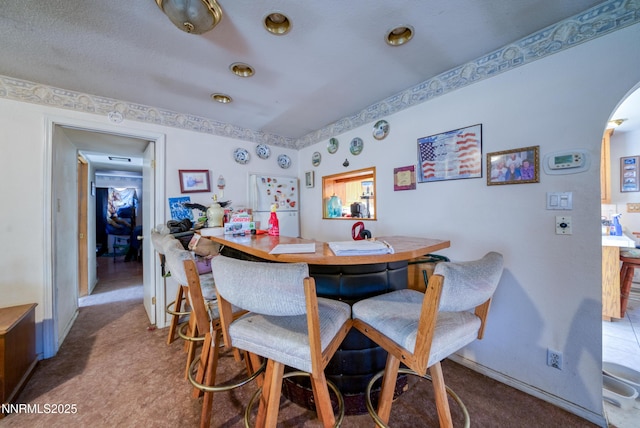 1650 Trabert Way, Sparks, NV 89431 - dining space with carpet floors, arched walkways, and baseboards