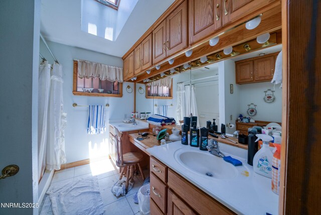 1650 Trabert Way, Sparks, NV 89431 - full bath with a skylight, vanity, tile patterned floors, and curtained shower