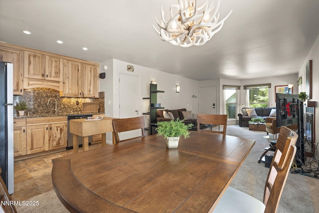 136 Juanita Dr Unit 53, Incline Village, NV 89451 - dining area featuring a chandelier, recessed lighting, and light stone finish flooring