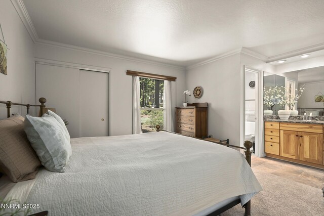 136 Juanita Dr Unit 53, Incline Village, NV 89451 - bedroom with ornamental molding, a closet, ensuite bath, and a sink