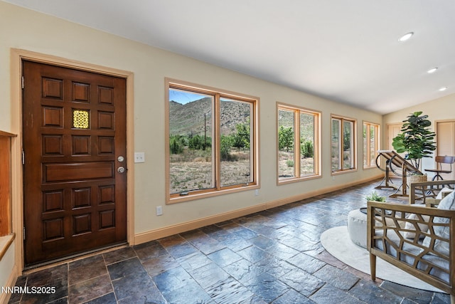105 Rodeo Dr, Reno, NV 89508 - foyer with stone tile flooring, recessed lighting, baseboards, and lofted ceiling