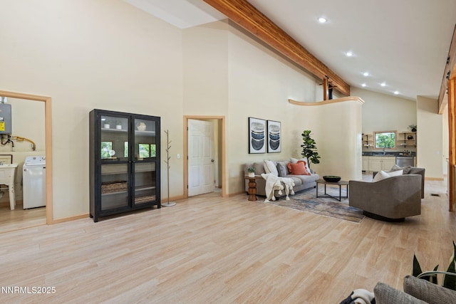 105 Rodeo Dr, Reno, NV 89508 - living room with washer / clothes dryer, high vaulted ceiling, wood finished floors, beam ceiling, and baseboards