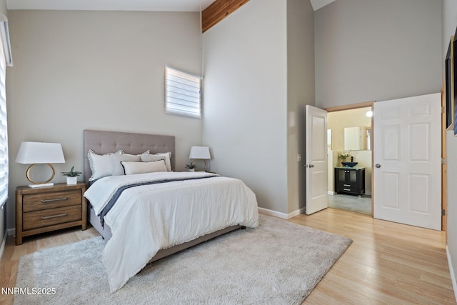 105 Rodeo Dr, Reno, NV 89508 - bedroom featuring light wood finished floors, high vaulted ceiling, and baseboards