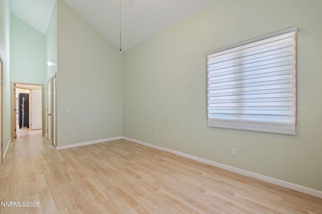 105 Rodeo Dr, Reno, NV 89508 - unfurnished room with light wood-type flooring, baseboards, and high vaulted ceiling