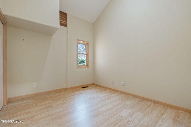 105 Rodeo Dr, Reno, NV 89508 - empty room with light wood-type flooring, high vaulted ceiling, and baseboards