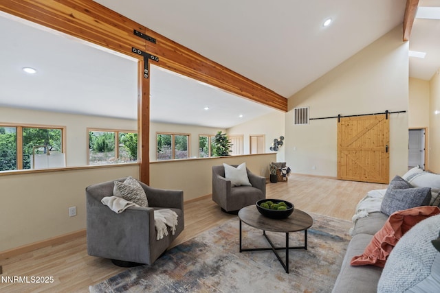 105 Rodeo Dr, Reno, NV 89508 - living area featuring beamed ceiling, wood finished floors, plenty of natural light, a barn door, and recessed lighting