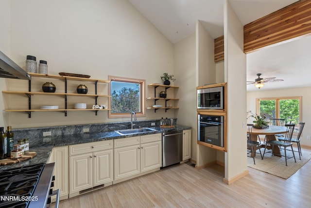 105 Rodeo Dr, Reno, NV 89508 - kitchen featuring appliances with stainless steel finishes, a sink, cream cabinets, light wood-type flooring, and open shelves