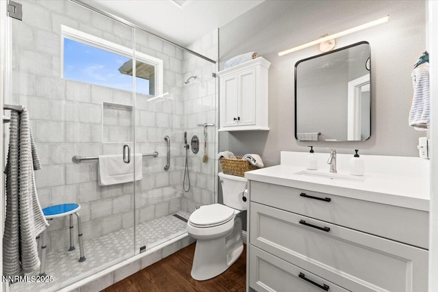 346 Wolf Run Ct, Reno, NV 89511 - bathroom featuring toilet, vanity, a stall shower, and wood finished floors