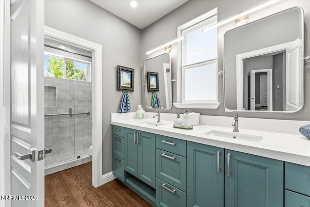 346 Wolf Run Ct, Reno, NV 89511 - bathroom featuring toilet, double vanity, a shower stall, and wood finished floors