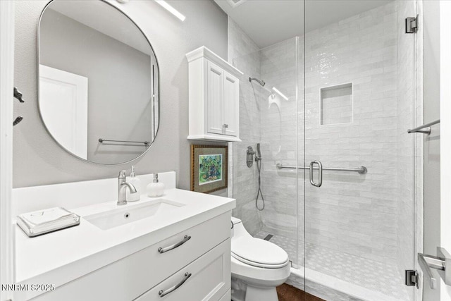 346 Wolf Run Ct, Reno, NV 89511 - bathroom featuring vanity, toilet, and a stall shower