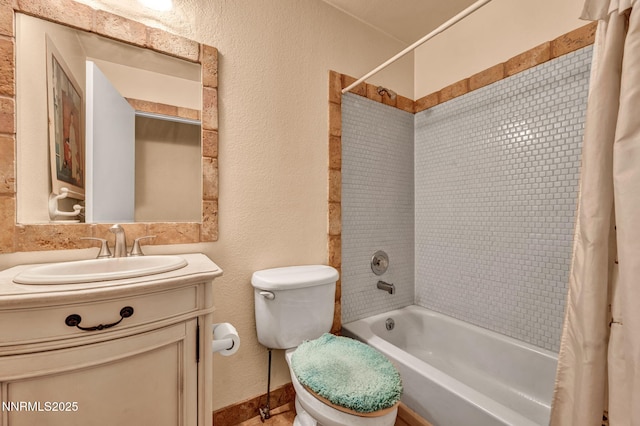 15333 Kivett Ln, Reno, NV 89521 - bathroom featuring shower / bath combo, toilet, vanity, a textured wall, and baseboards
