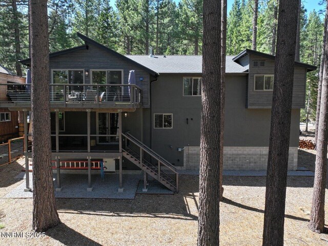 1877 Normuk St, South Lake Tahoe, CA 96150 - back of house featuring stairs, a patio area, and a wooden deck