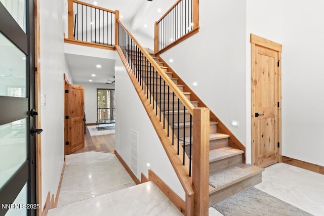 1877 Normuk St, South Lake Tahoe, CA 96150 - stairway featuring baseboards, recessed lighting, a towering ceiling, marble finish flooring, and ceiling fan