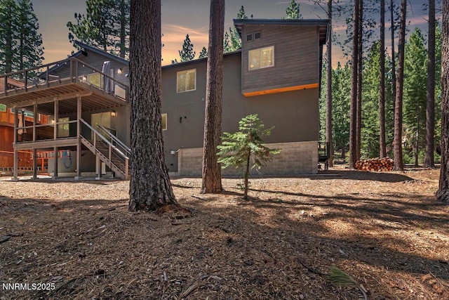 1877 Normuk St, South Lake Tahoe, CA 96150 - back of house featuring a deck, stairway, and stucco siding