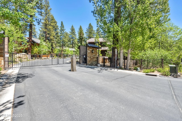 886 Rosewood Cir, Incline Village, NV 89451 - view of asphalt road featuring a gate, a gated entry, and curbs