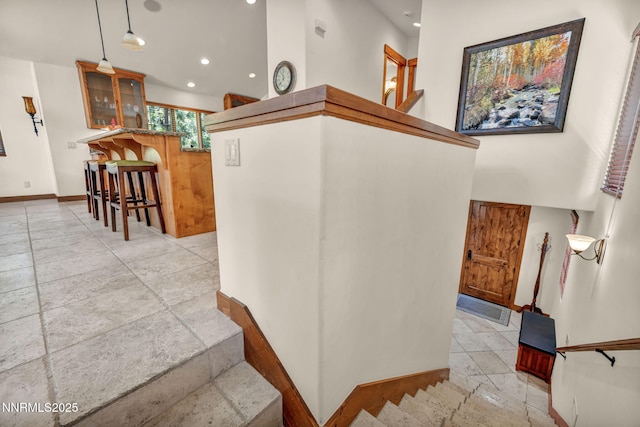 886 Rosewood Cir, Incline Village, NV 89451 - staircase with stone tile flooring, baseboards, recessed lighting, and a towering ceiling