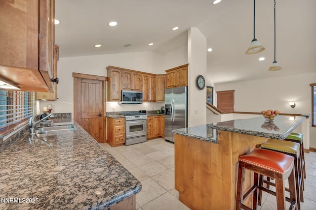 886 Rosewood Cir, Incline Village, NV 89451 - kitchen with stainless steel appliances, a sink, lofted ceiling, dark stone countertops, and a kitchen island